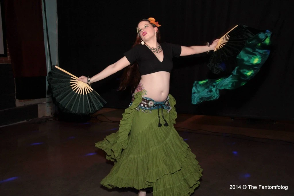 Me dancing with fan veils at a past Open Stage. Photo courtesy of Santa Joe.